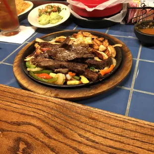 a plate of steak and vegetables