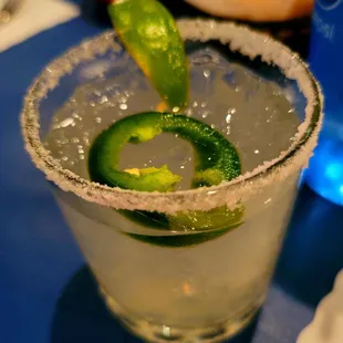 a margarita with a lime garnish