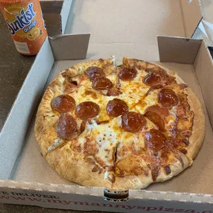 a pepperoni pizza in a box