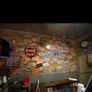 a wall of license plates