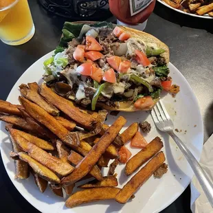 Philly cheesesteak and awesome fries.  Heck ya