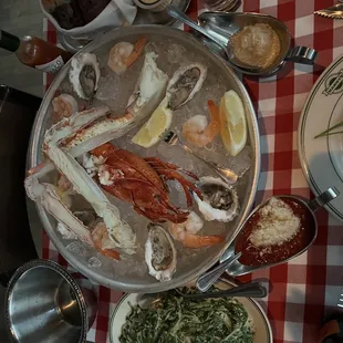 Seafood "tower," creamed spinach side, and bread basket.
