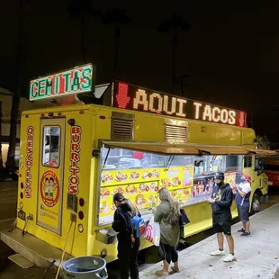 people ordering food from a food truck