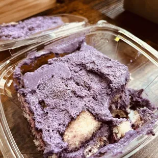 a purple dessert in a plastic container