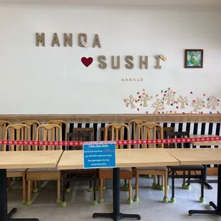 a long table and chairs in a restaurant
