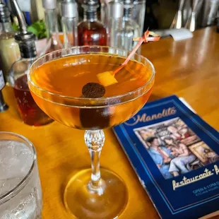 Martinez cocktail, while waiting for my Cuban sandwich and tajin crackers.