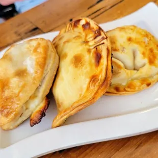 three pastries on a white plate