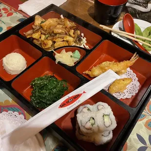 a bento box of japanese food