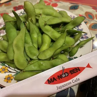 a plate of green beans on a table