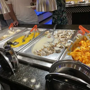 a variety of food items in a buffet