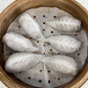 a basket of steamed dumplings
