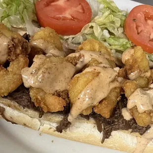 Surf N Turf Po-Boy!!

Fried Shrimp, Homemade Roast Beef Debris, and Homemade Remoulade Sauce.