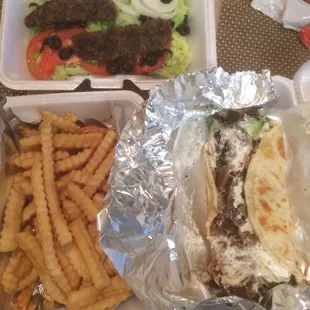 From top - beef kabobs over plain salad, beef gyro, and fries for $17.