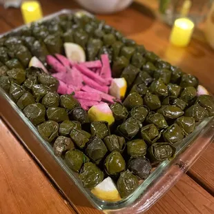 a glass dish filled with vegetables