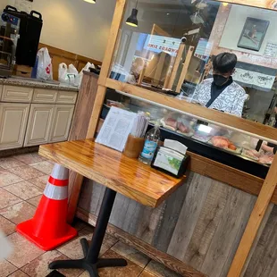 a dog sitting on a table in a restaurant