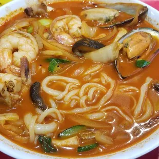 A more &quot;premium&quot; version of Jjampong spicy seafood noodles with more seafood toppings.
 
 &quot;Noodles w/ Mixed Seafood &amp; Vegetables&quot; on menu