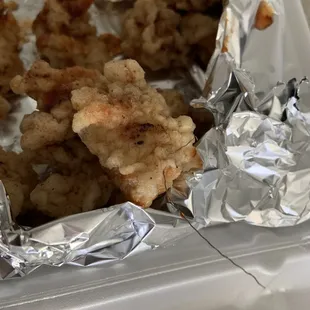 a piece of fried food in foil