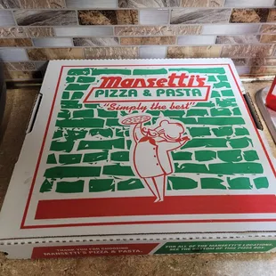 a woman holding a pizza