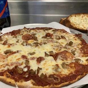 Monday &amp; Tuesday Special. Large or XL Pizza with 2 piece garlic toast with cheese + a 2 liter of pop!