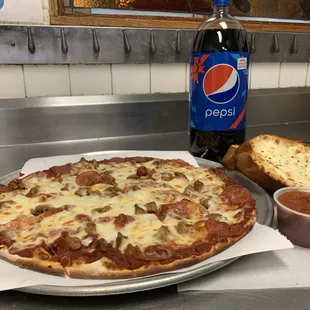 Monday &amp; Tuesday Special! Large or XL 2-topping pizza, 2 piece garlic toast with cheese + a 2-liter of pop.