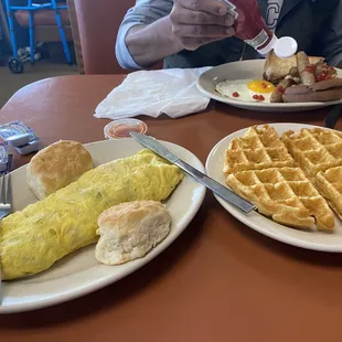 L-R veg omelette, sunny side egg and sausage and Belgian waffle
