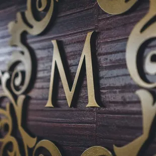 the letter m on the wall
