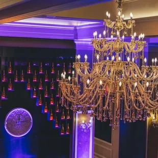 a chandelier and wine bottles