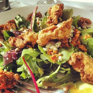 House salad with fried oysters.