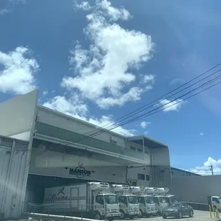 trucks parked in front of a warehouse