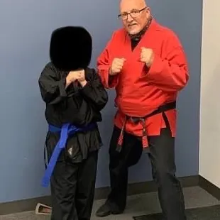 Sensei Mark &amp; my kid when he was promoted to blue belt!