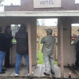 The competition is held in a quaint little "town". (Instructor is in brown).