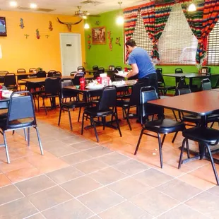 a restaurant with tables and chairs