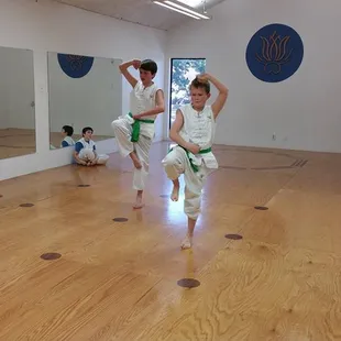 Two green sash's testing for their next sash color!