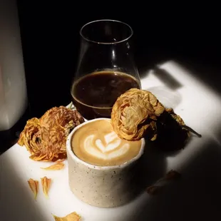 a cup of coffee and fried food