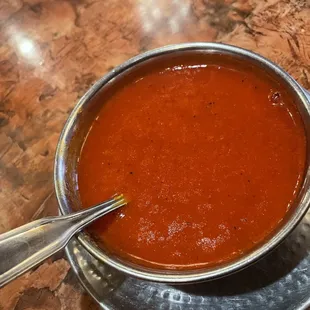 a bowl of soup with a spoon in it