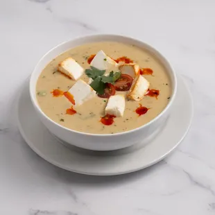 Methi Mutter Malai: A rich, creamy curry made with fenugreek leaves (methi), green peas, and aromatic spices for a luscious, flavorful dish