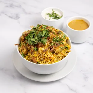 Paneer Biryani: A fragrant rice dish layered with marinated paneer, spices, and herbs, offering a rich and flavorful vegetarian delight