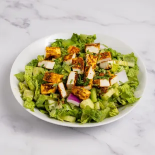 Paneer Tikka Salad: Grilled paneer cubes marinated in spices, served with fresh greens, veggies, and a tangy dressing for a flavorful twist!