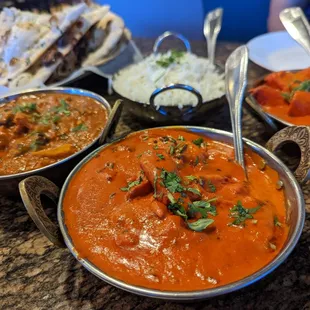 Clockwise starting top left: 3xGarlic naan $3.50x3, basmati rice $4, chicken tikka marsala $17, butter chicken $17, karahi chicken $15