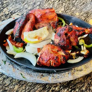 a plate of chicken and vegetables