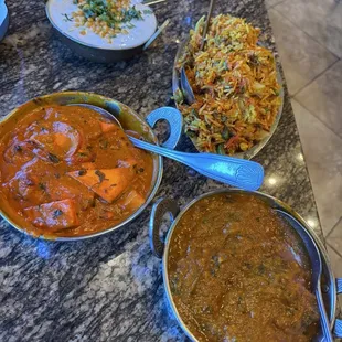 Fish Curry, Vegetable Biryani, Paneer Tikka Masala, and Raita.