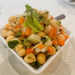 a bowl of chickpeas and vegetables