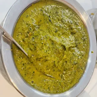 a bowl of soup with a spoon