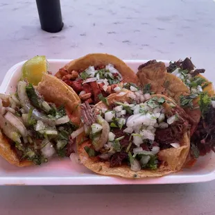 Pastor, lengua, barbacoa, and quesabirria tacos