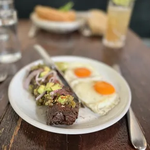 Grilled grass-fed hanger steak with charred poblano &amp; tomatillo vinaigrette, avocado, fried eggs