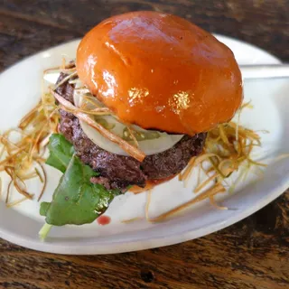 Venison Burger, Pickled Green Tomato, Arugula, Crisp Leeks, Garlic Aioli, Brioche Bun