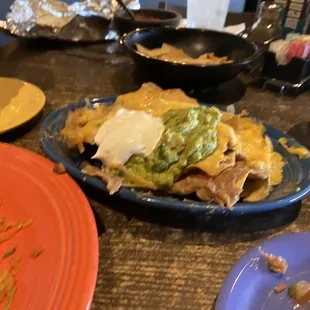 Nachitos appetizer, side of rice plus chips and salsa.