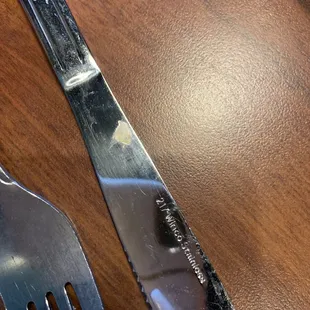 Nasty, dried up cheese on fork. Did not wash right