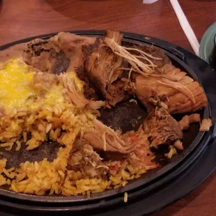 Carnitas with rice and beans.