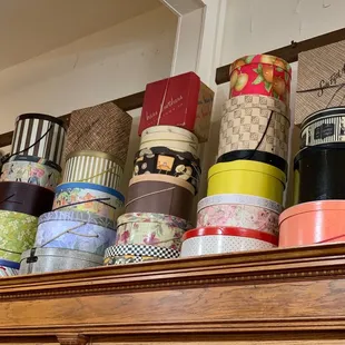 The decor of many vintage hat boxes around the store was beautiful